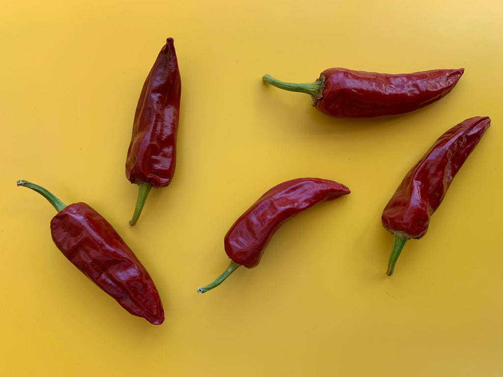 red chiles on yellow background