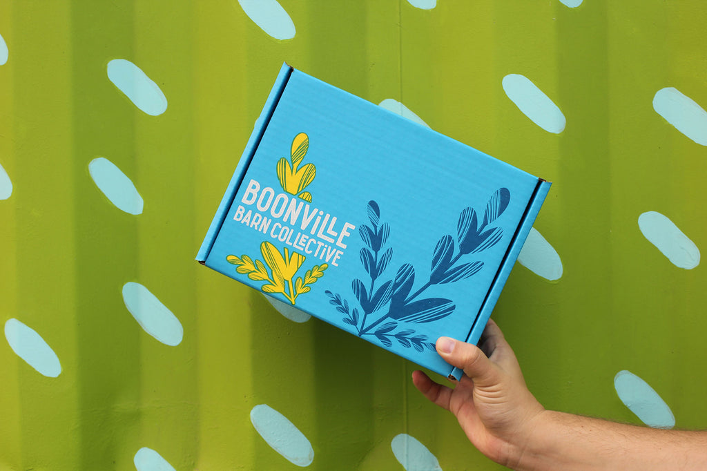 blue box in front of green wall