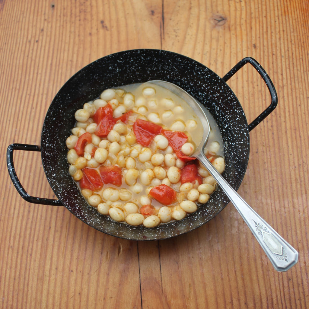 bowl of beans with chopped tomato and chile